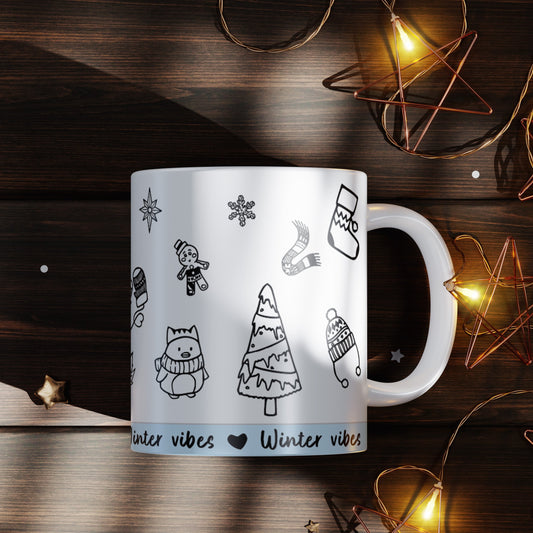 Taza de invierno con diseño Winter Vibes y ilustraciones invernales, perfecta para regalar en Navidad.